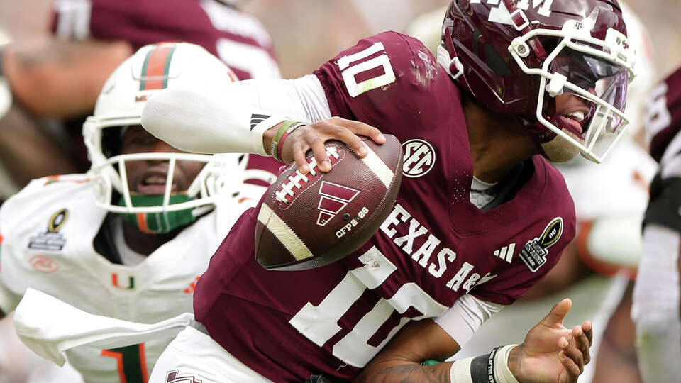 Marcel Reed (10) of Texas A&M runs with the ball in the first quarter against Miami during the 2025 College Football Playoff First Round Game at Kyle Field on Dec. 20, 2025 in College Station. (Photo by Alex Slitz/Getty Images)