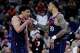 Los Angeles Clippers guard Kobe Sanders, left, reacts with forward John Collins during the second half of an NBA basketball game against the San Antonio Spurs Monday, March 16, 2026, in Inglewood, Calif. (AP Photo/Ryan Sun)