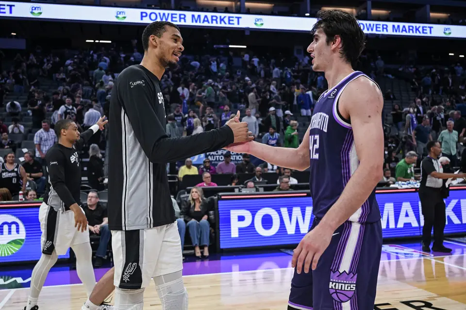 San Antonio Spurs forward Victor Wembanyama (1) and Sacramento Kings center Maxime Raynaud (42) shake hands after the Spurs defeat the Kings an NBA basketball game, Tuesday, March 17, 2026, in Sacramento, Calif. (AP Photo/Justine Willard)