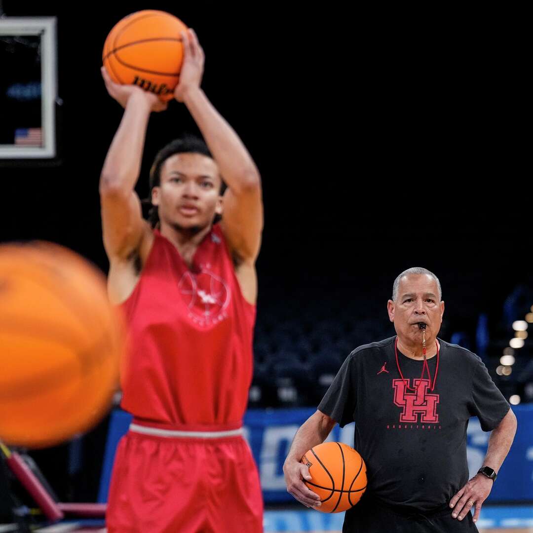 Houston head coach Kelvin Sampson watches his players work out as Houston guard Kingston Flemings (4) takes a shot during practice prior to the first round of the NCAA college basketball tournament in Oklahoma City, Wednesday, March 18, 2026.