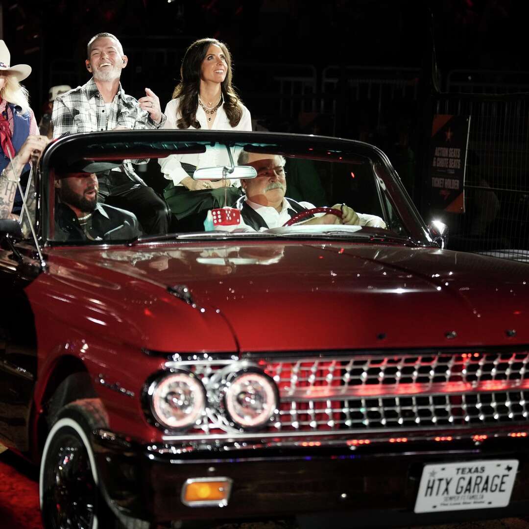 Patt Mann Phillips, chairman of the board of the Houston Livestock Show & Rodeo, enter the arena at NRG Stadium alongside rapper Paul Wall, Houston Texans Vice President Hannah McNair, singer Koe Wetzel and Houston Texans CEO Cal McNair during the Houston Livestock Show and Rodeo, Wednesday, March 18, 2026, in Houston.