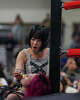 Tokyo Joshi Pro Wrester Rika Tatsumi shoves popcorn into Yuki Aino’s mouth as they wrestle in the all-female Texas Stampede showcase during South by Southwest in Austin, Wednesday, March 18, 2026. Joshi Pro Wrestling blends WWE-style combat entertainment and Japanese pop idol culture into wrestling performances.