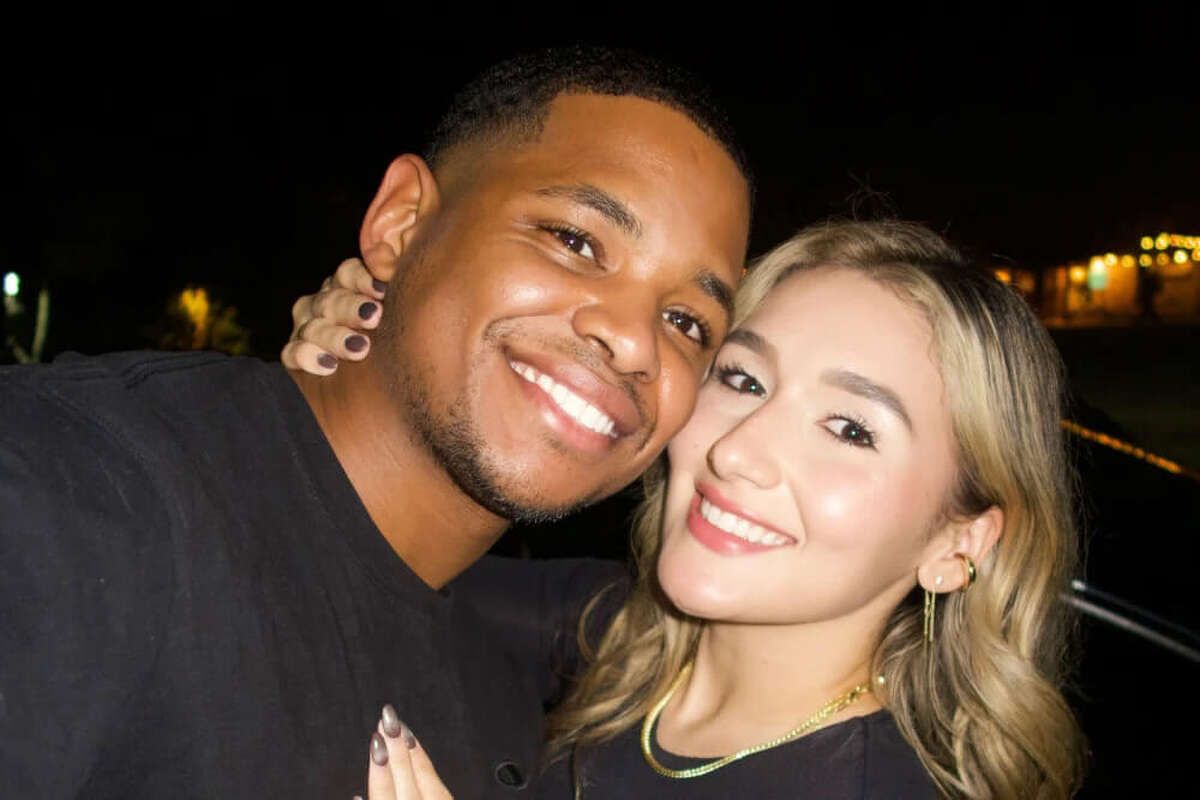 Chris Busby, left, with his wife, Stephanie Kenny Velasquez.
