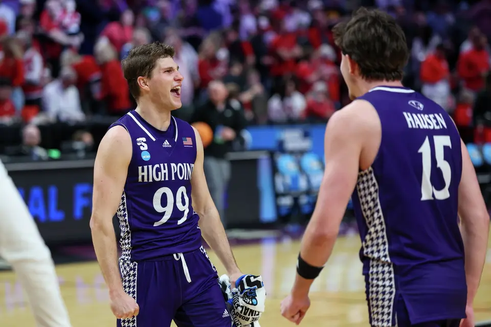 High Point guard Chase Johnston (99) celebrates with High Point forward Braden Hausen (15) after the first round of the NCAA college basketball tournament against Wisconsin, Thursday, March 19, 2026, in Portland, Ore. (AP Photo/Craig Mitchelldyer)