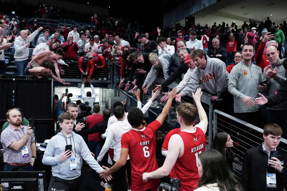 Miami (Ohio) players celebrate with fans following a First Four college basketball game against SMU in the NCAA Tournament in Dayton, Ohio, Wednesday, March 18, 2026. (AP Photo/Jeff Dean)