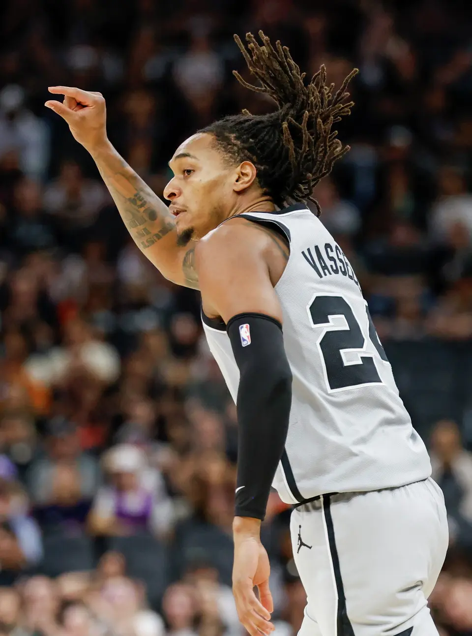 San Antonio Spurs guard Devin Vassell (24) makes the “clock it” sign after making a shot at Frost Bank Center in San Antonio, Thursday, March 19, 2026.