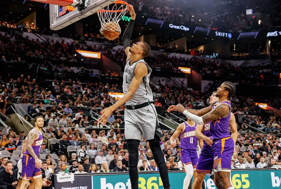 San Antonio Spurs guard Jordan McLaughlin (0) dunks the ball at Frost Bank Center in San Antonio, Thursday, March 19, 2026.