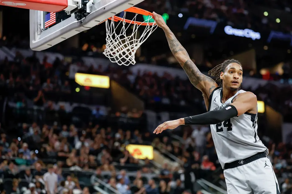 San Antonio Spurs guard Devin Vassell (24) dunks the ball at Frost Bank Center in San Antonio, Thursday, March 19, 2026. The Spurs won in the last second, 101-100.