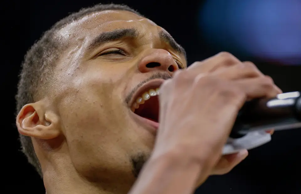 San Antonio Spurs forward Victor Wembanyama (1) yells into the microphone after a win at Frost Bank Center in San Antonio, Thursday, March 19, 2026. The Spurs won in the last second, 101-100.