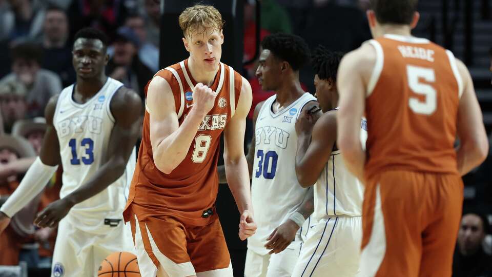 Texas center Matas Vokietaitis (8) reacts during the second half in the first round of the NCAA college basketball tournament against BYU, Thursday, March 19, 2026, in Portland, Ore. (AP Photo/Amanda Loman)