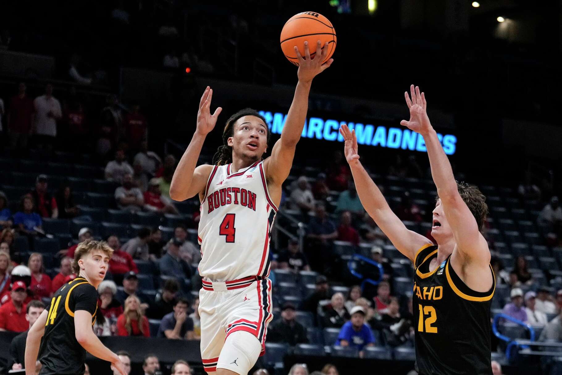 Houston guard Kingston Flemings (4) takes a shot against Idaho forward Jackson Rasmussen (12) during the second half in the first round of the NCAA college basketball tournament in Oklahoma City, Thursday, March 19, 2026.