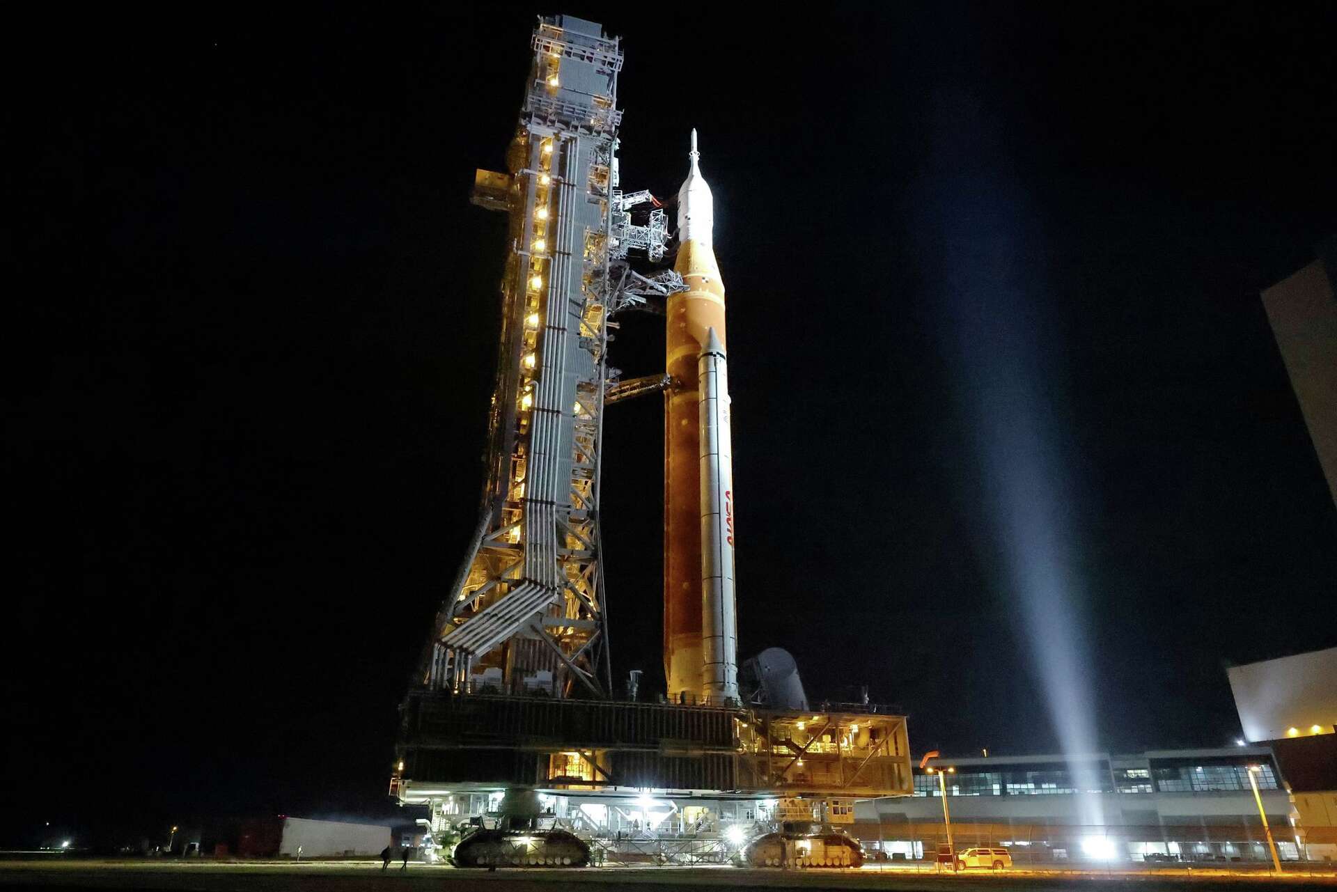 NASA hauls its repaired moon rocket from the hangar back to the pad for ...