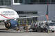 A worker refuels an AeroMexico plane at San Francisco International Airport in 2022. With prices for jet fuel rising amid the war with Iran, experts say travelers should consider booking summer airfares now.