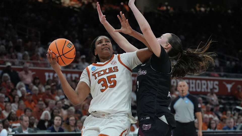 Texas forward Madison Booker (35) drives against Missouri State guard Kendal Brueggen (3) during the second half in the first round of the NCAA college basketball tournament game, Friday, March 20, 2026.