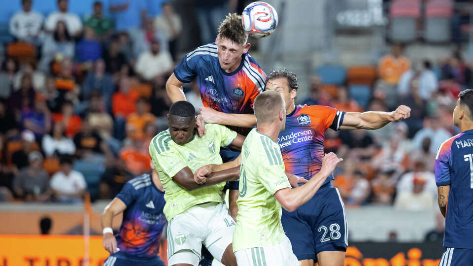 Agustin Resch of the Houston Dynamo FC heads a ball during the second half of a game against the Portland Timbers at Shell Energy Stadium on March 14, 2026 in Houston, Texas.