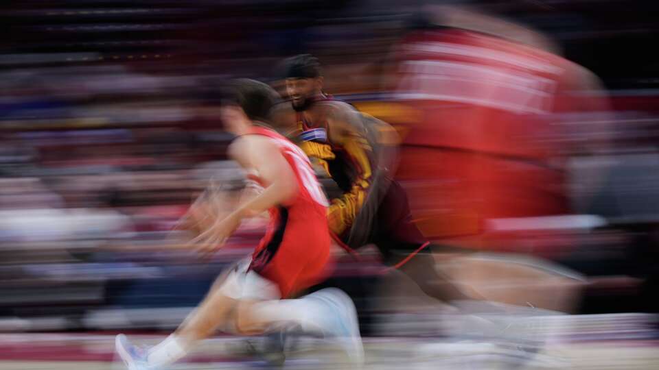 Atlanta Hawks guard Nickeil Alexander-Walker (7) defends against Houston Rockets guard Reed Sheppard (15) during the first half of an NBA basketball game in Houston, Friday, March 20, 2026. (AP Photo/Ashley Landis)