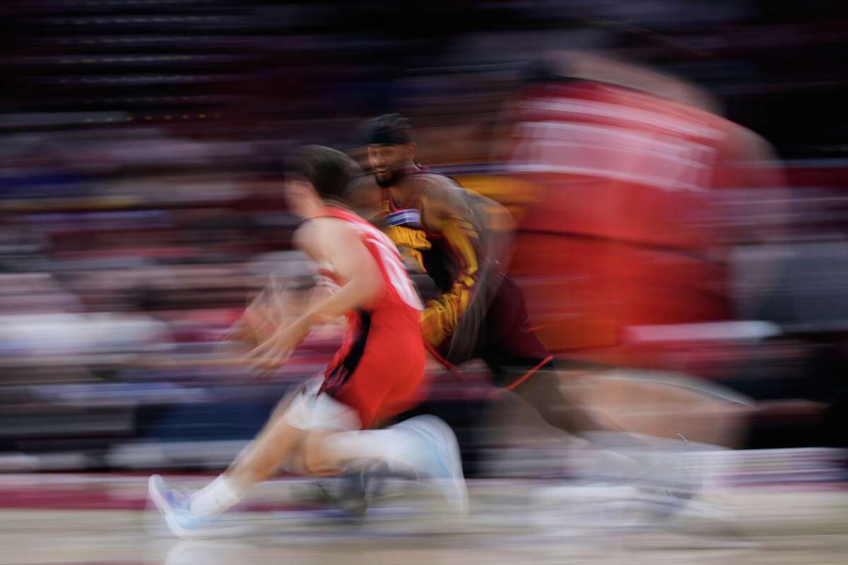 Atlanta Hawks guard Nickeil Alexander-Walker (7) defends against Houston Rockets guard Reed Sheppard (15) during the first half of an NBA basketball game in Houston, Friday, March 20, 2026. (AP Photo/Ashley Landis)