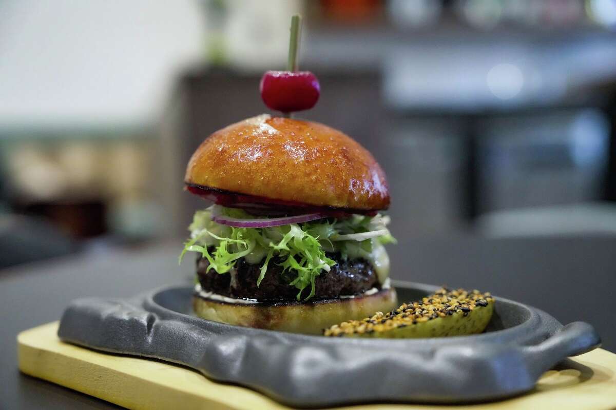 A burger is photographed at Toga, a yakitori-focused izakaya by Comma Hospitality, ahead of its opening in Houston on Thursday, March 19, 2026.