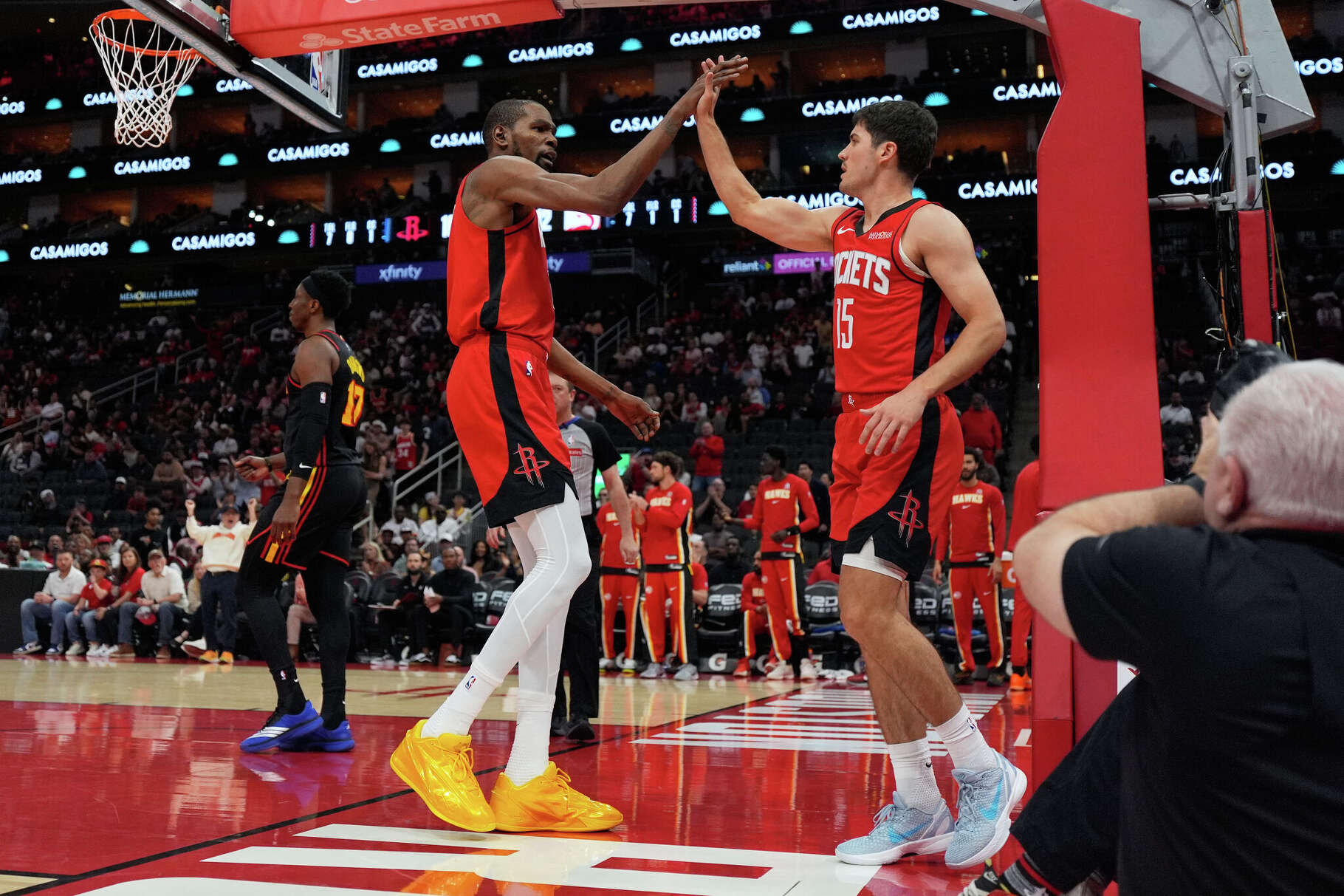 Houston Rockets forward Kevin Durant (7) celebrates with guard Reed Sheppard (15) during the first half of an NBA basketball game against the Atlanta Hawks in Houston, Friday, March 20, 2026. (AP Photo/Ashley Landis)