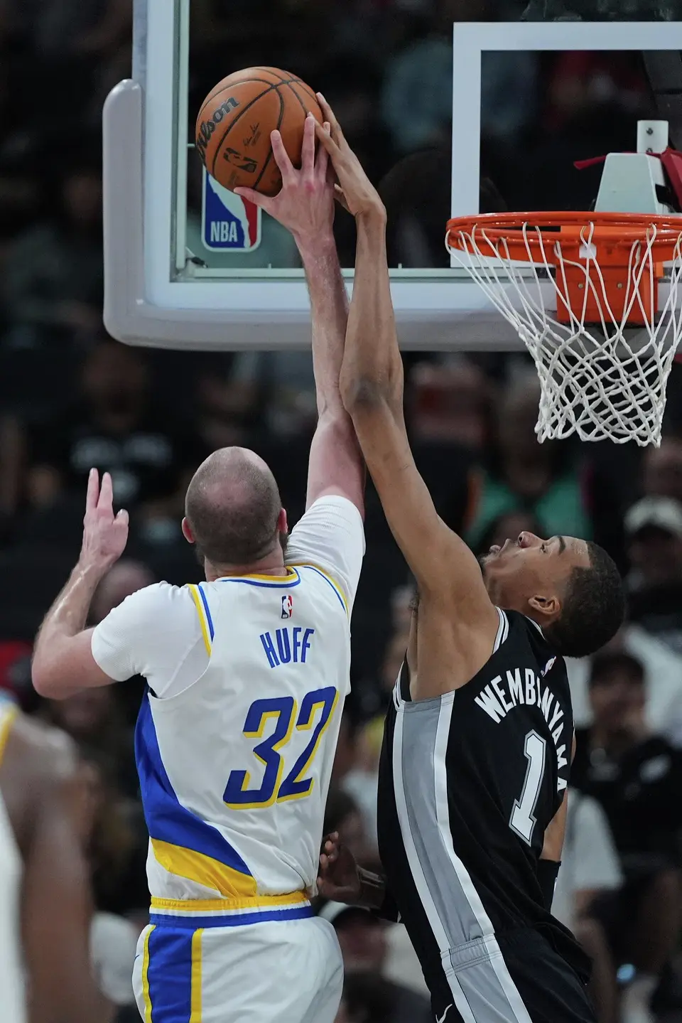 Indiana Pacers center Jay Huff (32) is blocked by San Antonio Spurs forward Victor Wembanyama (1) during the first half of an NBA basketball game in San Antonio, Saturday, March 21,2026. (AP Photo/Eric Gay)