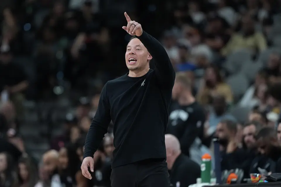 San Antonio Spurs head coach Mitch Johnson signals to his players during the second half of an NBA basketball game against the Indiana Pacers in San Antonio, Saturday, March 21,2026. (AP Photo/Eric Gay)