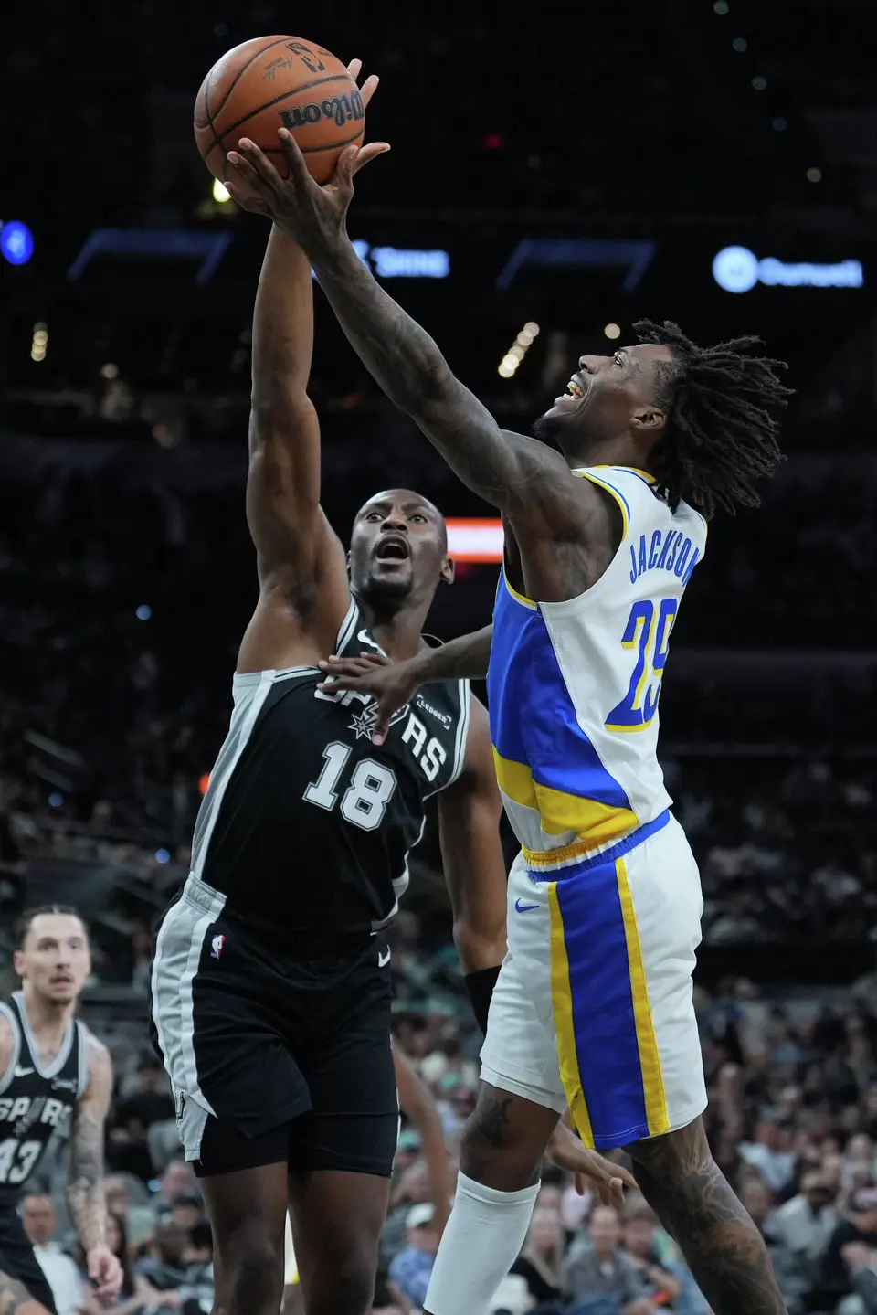 Indiana Pacers guard Quenton Jackson (29) drives to the basket against San Antonio Spurs center Bismack Biyombo (18) during the second half of an NBA basketball game in San Antonio, Saturday, March 21,2026. (AP Photo/Eric Gay)