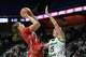 Greenwich's Elsa Xhekaj (5) puts up a shot over Northwest Catholic's Samantha Casper (15) during their CIAC Division I girls basketball final Saturday, March 21, 2026 at Mohegan Sun Arena in Uncasville, Conn.