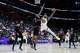 Warriors guard De’Anthony Melton goes up to shoot against Pistons forward Paul Reed on Friday night.