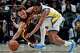 Warriors guard De'Anthony Melton, right, and Hawks guard Dyson Daniels chase a loose ball during the second half of Saturday's game Atlanta.