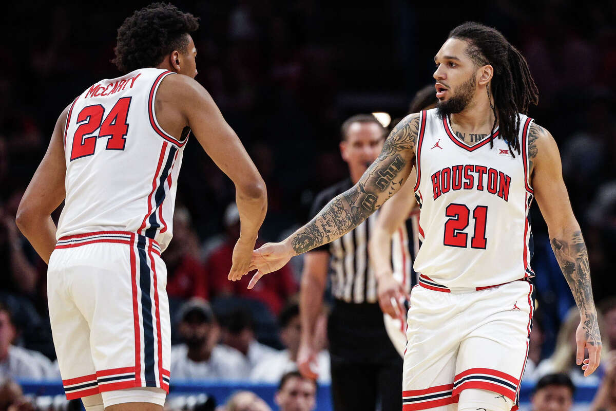 Emanuel Sharp celebrates with Chase McCarty as the Houston Cougars now find themselves back home in the Sweet 16 in their own city. 