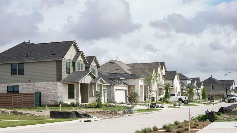 Prospective residents tour Austin Point, a new 4,700-acre master-planned community expected to house about 50,000 residents at full buildout, ahead of the opening of its first phase in Fort Bend County , Tuesday, March 24, 2026.