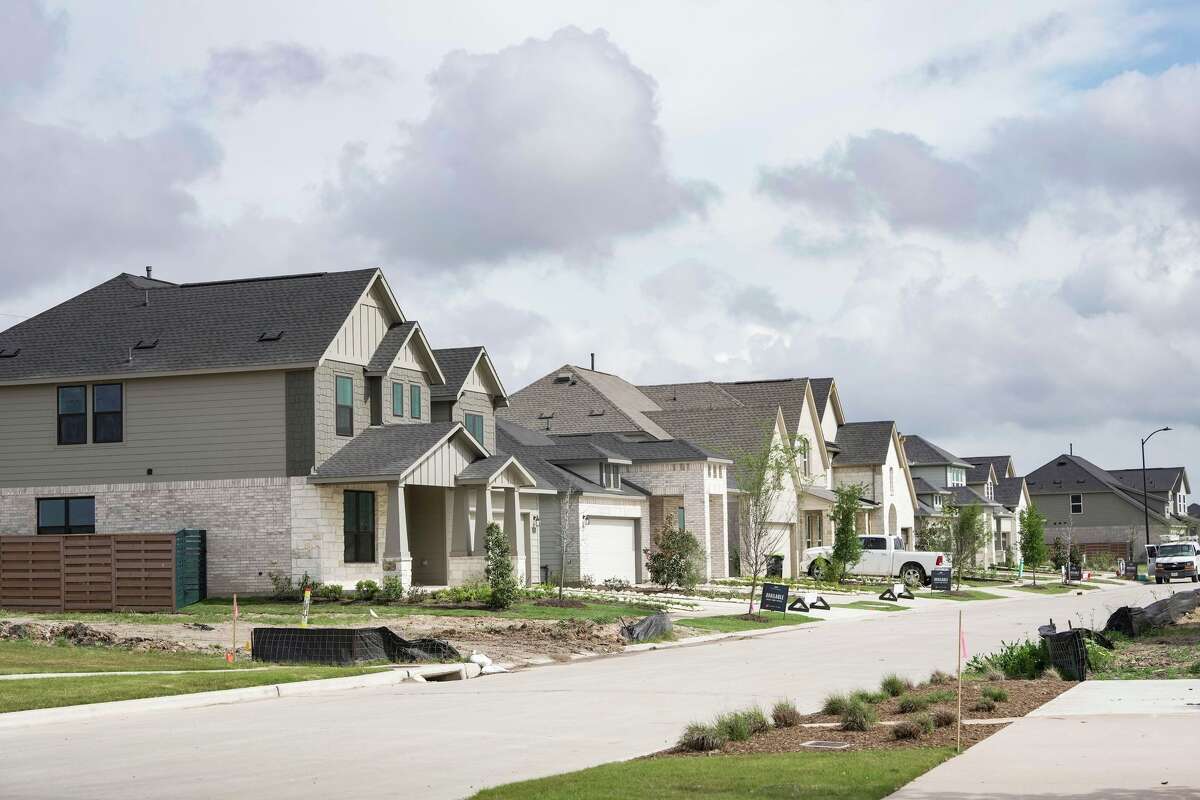 Prospective residents tour Austin Point, a new 4,700-acre master-planned community expected to house about 50,000 residents at full buildout, ahead of the opening of its first phase in Fort Bend County , Tuesday, March 24, 2026.