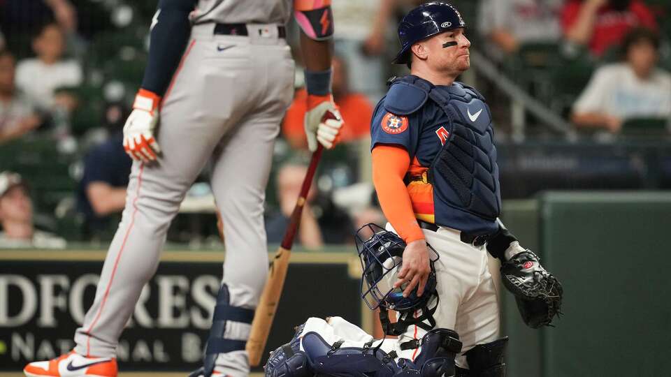 Houston Astros catcher Christian Vásquez waits to see the results of his challenge during an exhibition game at Daikin Park in Houston, Tuesday, March 24, 2026.