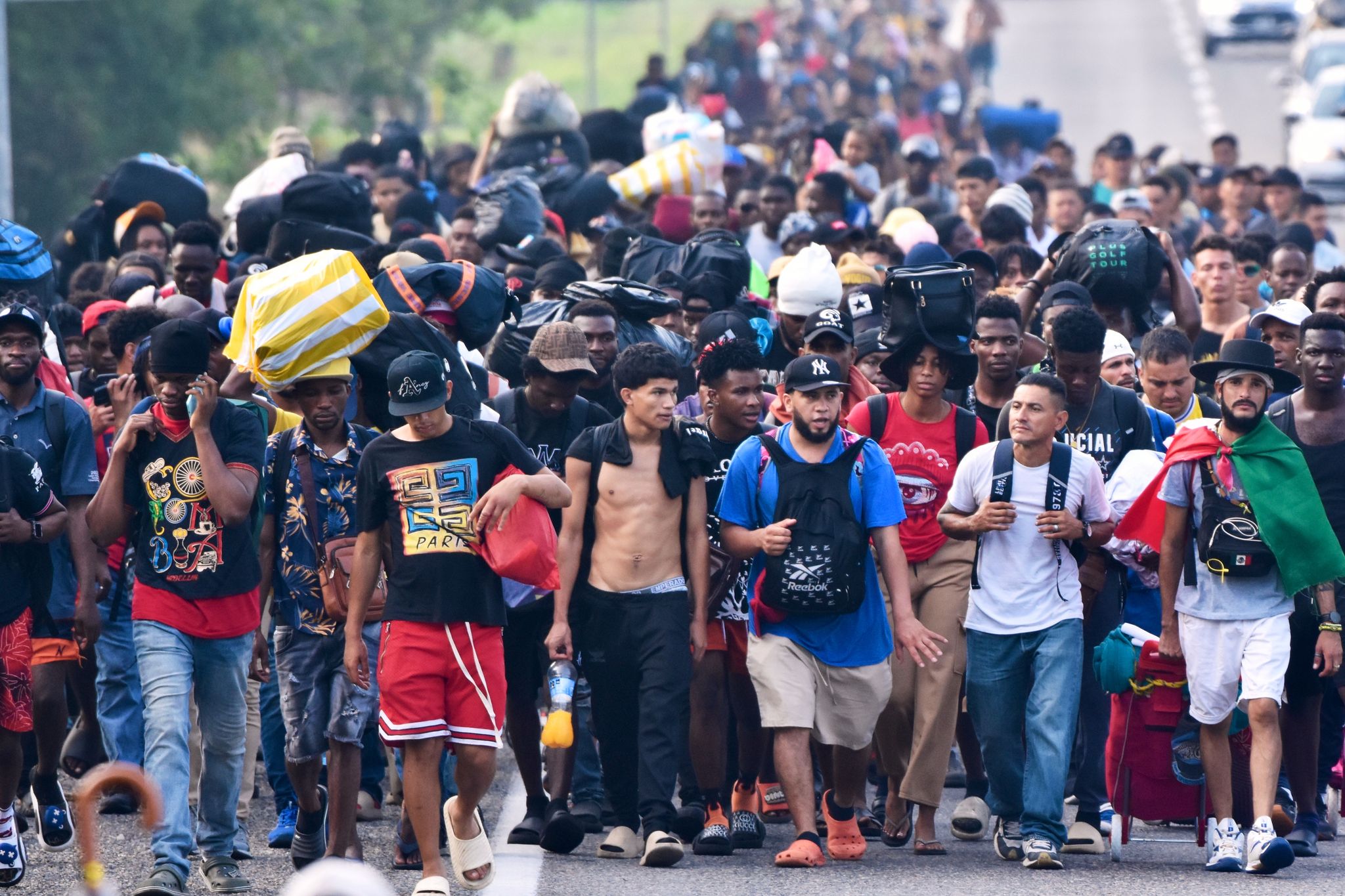 Migrants march from southern Mexico, protesting delays and seeking ...