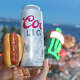 A 9-9-9 challenge hot dog is shown next to the Coors Light tallboy for scale during a San Francisco Giants game at Oracle Park on Tuesday night, March 24, 2026.