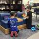 Two elementary schoolers work together to code and pilot Dash Robots in the makerspace of Jersey School District’s East Elementary School Building.