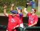 Bennett School players and coaches cheer during a high school sports academy baseball game in Houston, Wednesday, March 25, 2026.
