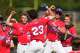 Bennett School players celebrate after Clayton Crosby’s home run during a high school sports academy baseball game in Houston, Wednesday, March 25, 2026.
