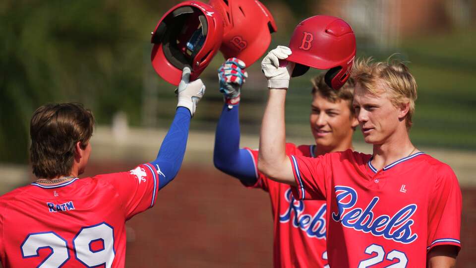 Bennett School's Karson Reeder, right, celebrates after a home run during a high school sports academy baseball game in Houston, Wednesday, March 25, 2026.