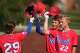 Bennett School’s Karson Reeder, right, celebrates after a home run during a high school sports academy baseball game in Houston, Wednesday, March 25, 2026.