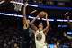 Warriors forward Gui Santos, who scored a career-high 31 points, shoots against Brooklyn Nets forward Josh Minott during the second half of Wednesday’s game at Chase Center.