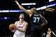 Houston Rockets center Alperen Sengun, left, drives toward the hoop against Minnesota Timberwolves center Rudy Gobert (27) during the first half of an NBA basketball game, Wednesday, March 25, 2026, in Minneapolis.