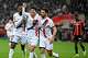PSG's Pedro Fernandez, center, celebrates after scoring his side's third goal during the French League One soccer match between Nice and Paris Saint-Germain in Nice, France, Saturday, March 21, 2026.