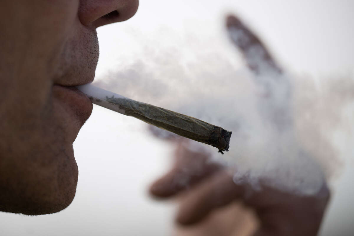 27 March 2024, Berlin: A man smokes a joint. On 22 March 2024, the Federal Council cleared the way for the partial legalization of cannabis on 1 April. Photo: Sebastian Gollnow/dpa (Photo by Sebastian Gollnow/picture alliance via Getty Images)