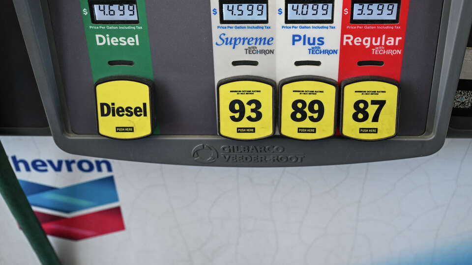 Gasoline prices are seen at a Chevron gas station in Houston, Texas, on March 16, 2026. Oil prices retreated and equities rose Monday as investors remained focused on the Strait of Hormuz, with US allies pushing back against President Donald Trump's demands to help reopen the key waterway to oil and natural gas tankers. (Photo by RONALDO SCHEMIDT / AFP via Getty Images)