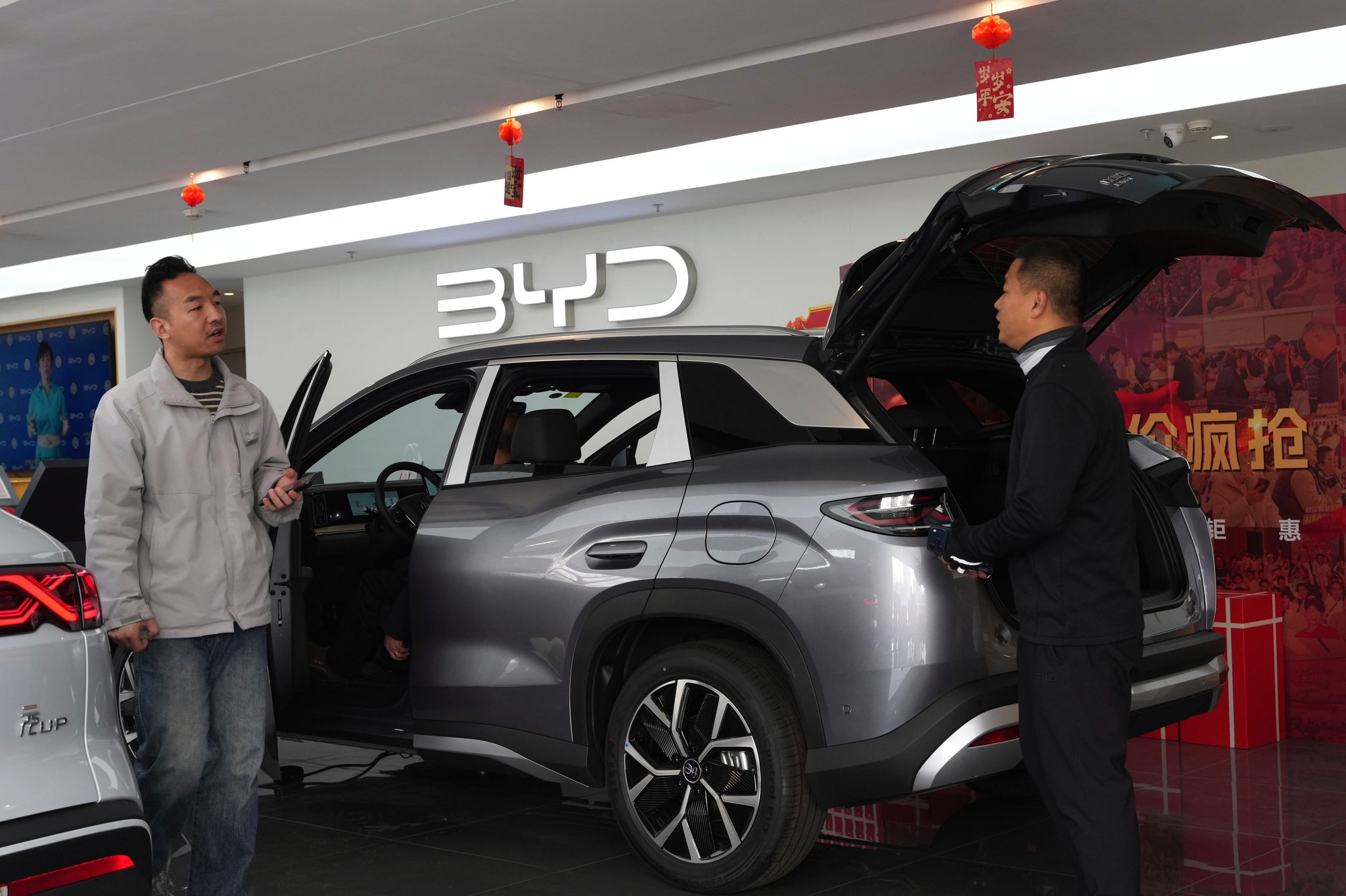 China's BYD sees first profit drop since 2021, even as the Tesla-rival ...