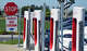 Electric car drivers charge up their vehicles at a Tesla Supercharger in Fountain Valley in March 2022.