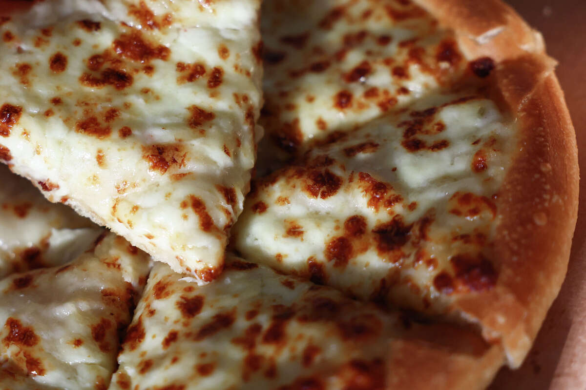 Margherita pizza on white sauce from Pizza Hut is seen in this illustration photo taken in Krakow, Poland on March 16, 2025.