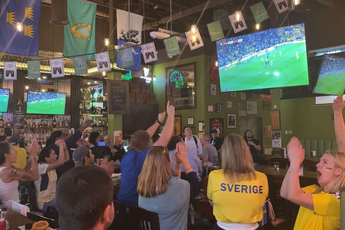 Fans at the Sweden-Ukraine watch party at Hugh O'Connor's in Houston react after Sweden takes a 3-0 lead on Thursday, March 26, 2026.