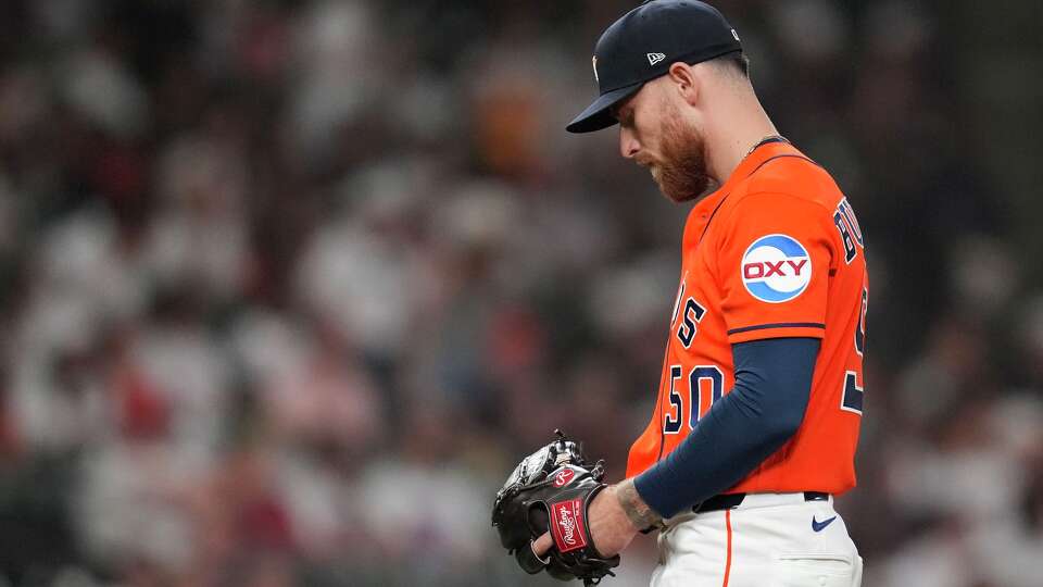 Houston Astros starting pitcher Mike Burrows (50) reacts after giving up a two-run home run to Los Angeles Angels Josh Lowe during the second inning of a MLB baseball game at Daikin Park, Friday, March 27, 2026, in Houston.